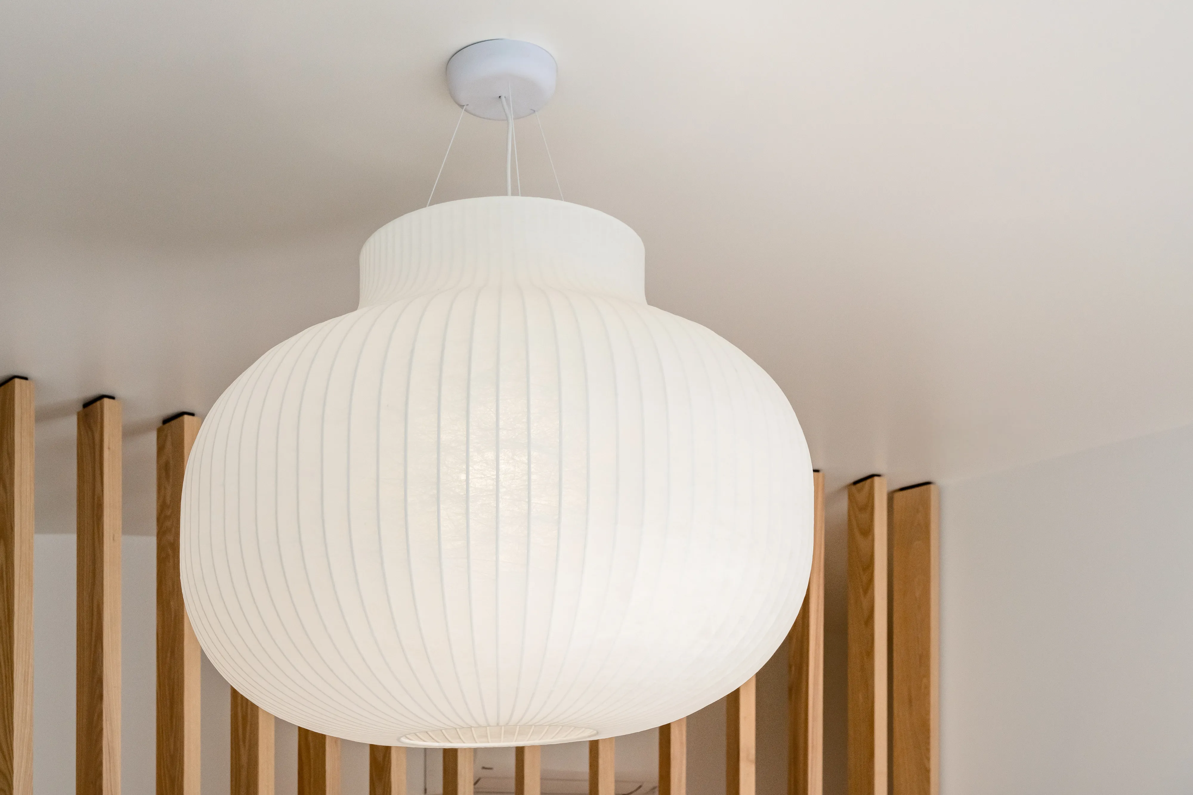 Brass pendant lighting in GROOM clinic's reception area